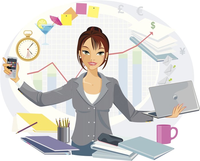 Distracted multi-tasking female business person who is frustrated