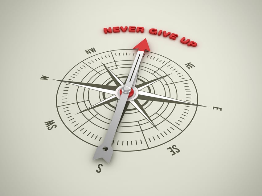 Scaling company navigating difficult terrain with compass representing resolve and accountability